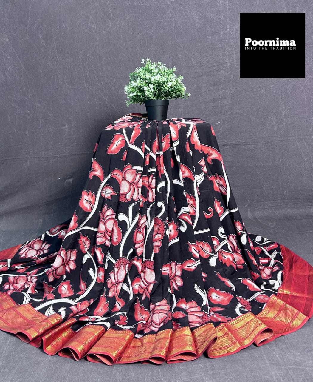 BLACK AND LIGHT RED COMBINATION WITH COLUMAKARY PRINTS WITH GOLD KANCHI BORDER