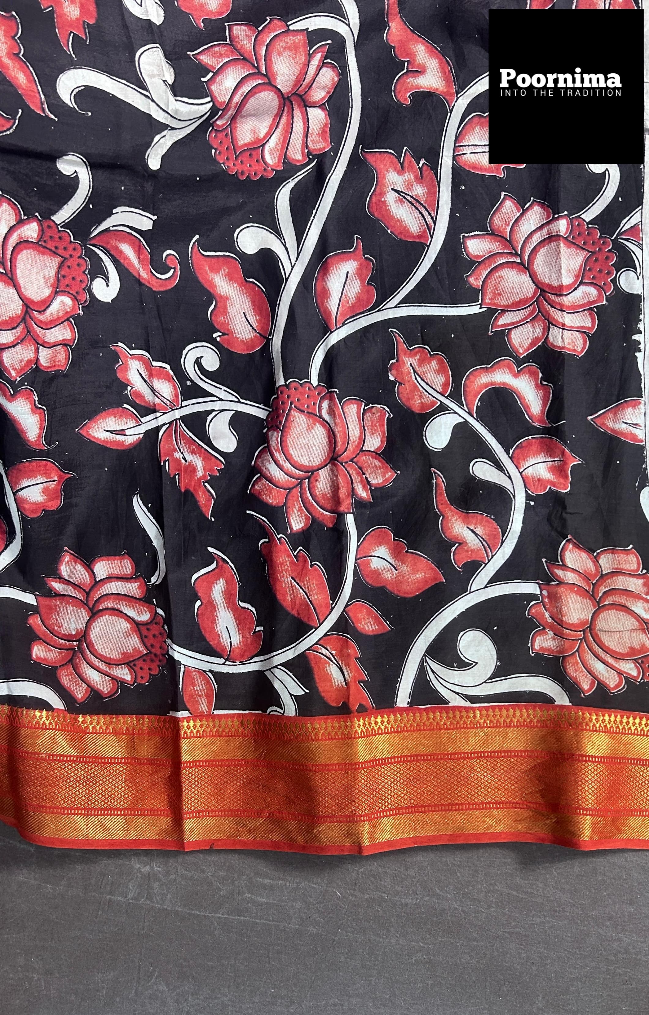 BLACK AND LIGHT RED COMBINATION WITH COLUMAKARY PRINTS WITH GOLD KANCHI BORDER