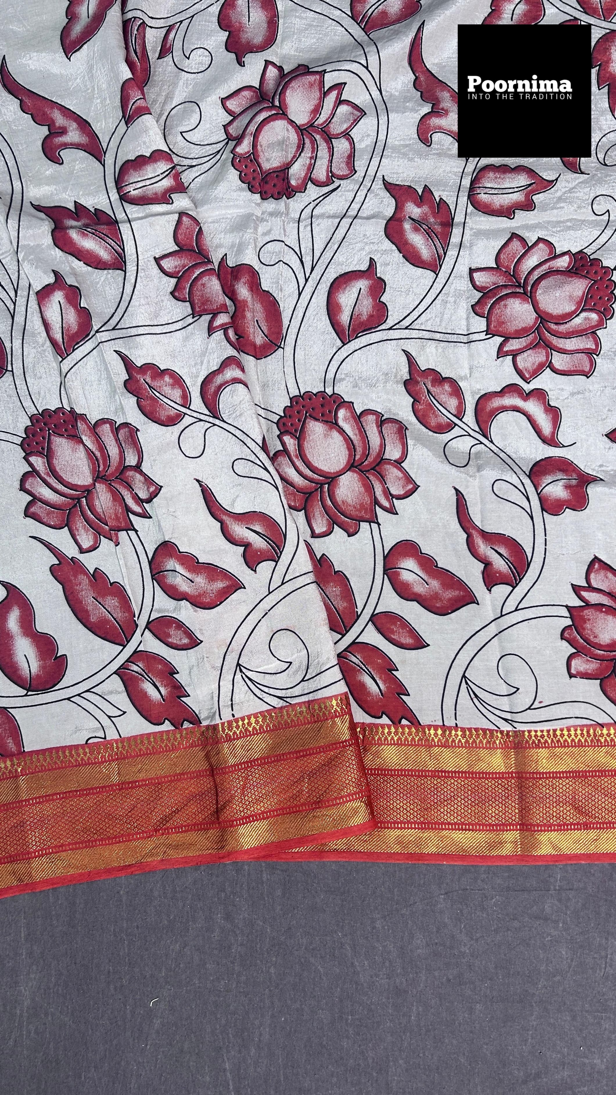 BLACK AND LIGHT RED COMBINATION WITH COLUMAKARY PRINTS WITH GOLD KANCHI BORDER