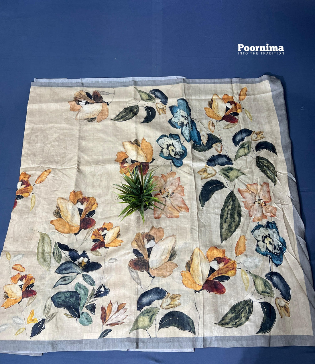 THUSSER WITH CREAM COLOUR ALOOVER SAREES WITH SOME FLOWERS AND LIFES DESIGN