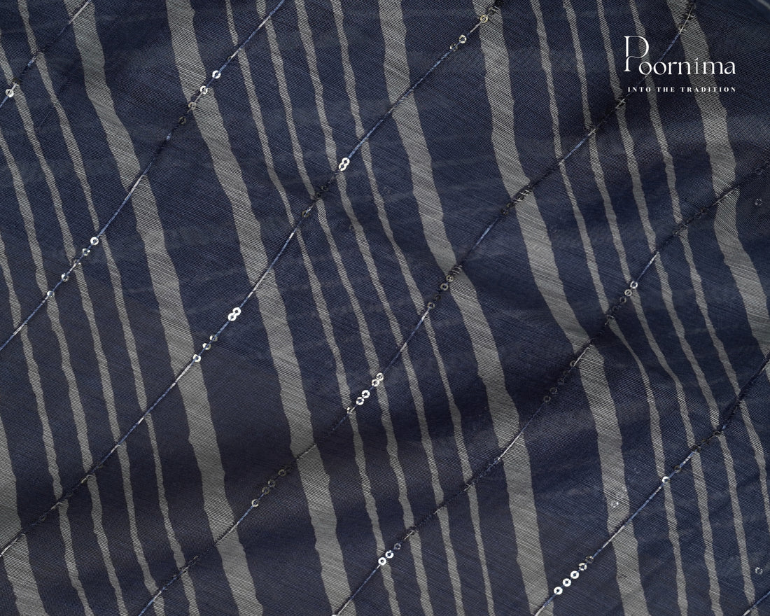 BLUE - SEMI CREPE SAREE WITH LINES DISCHARGE PRINT, SEQUINS WORK & TEMPLE PATTERN ZARI BORDER